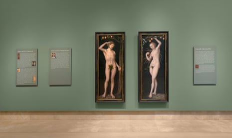 A diptych of Adam and Eve hangs on a museum wall
