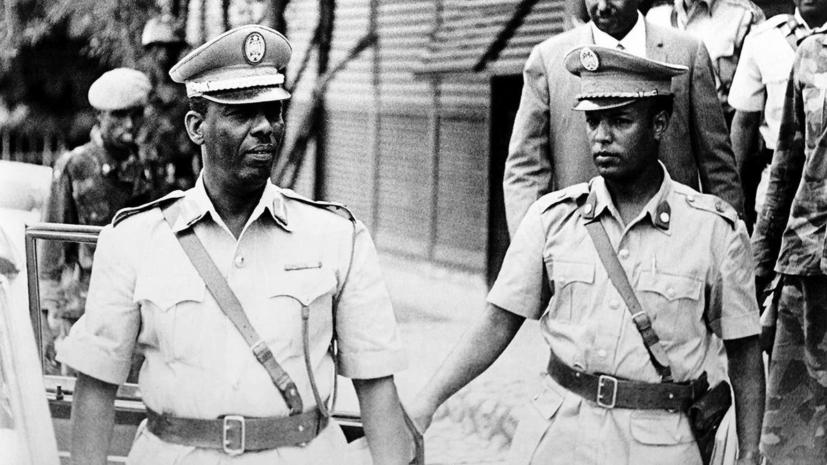 Mohamed Siad Barre stands with military officers and senior regime officials in Mogadishu.
