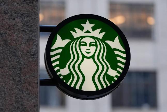 The Starbucks logo is displayed on a coffee shop in November 2025 in Boston, USA.